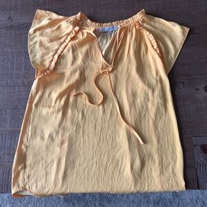 Sunshine yellow loft, short sleeve blouse.